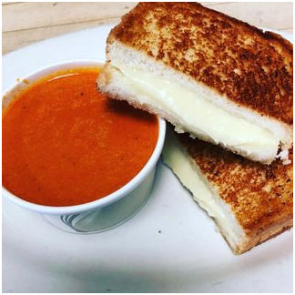 Homemade tomato soup and a grilled cheese